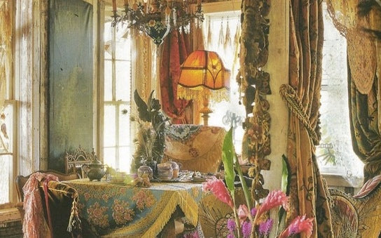 Magnolia Pearl vintage-inspired artisan room with eclectic decor, whimsical fabrics, and warm light