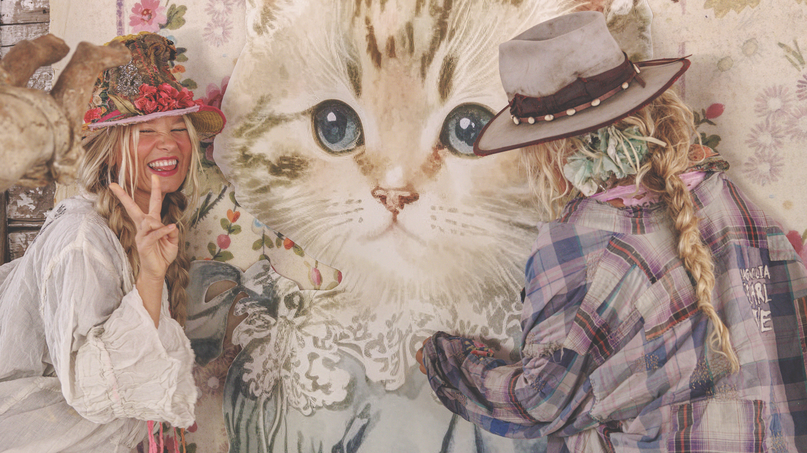Magnolia Pearl artisan clothing with whimsical vintage style, two women by large cat art