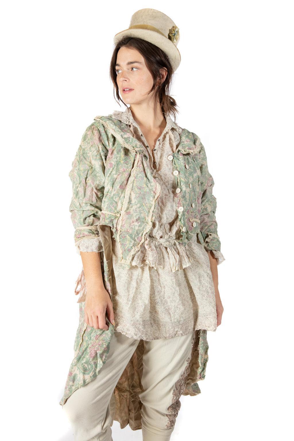 Woman wearing Magnolia Pearl artisan vintage floral coat, lace details, whimsical top hat