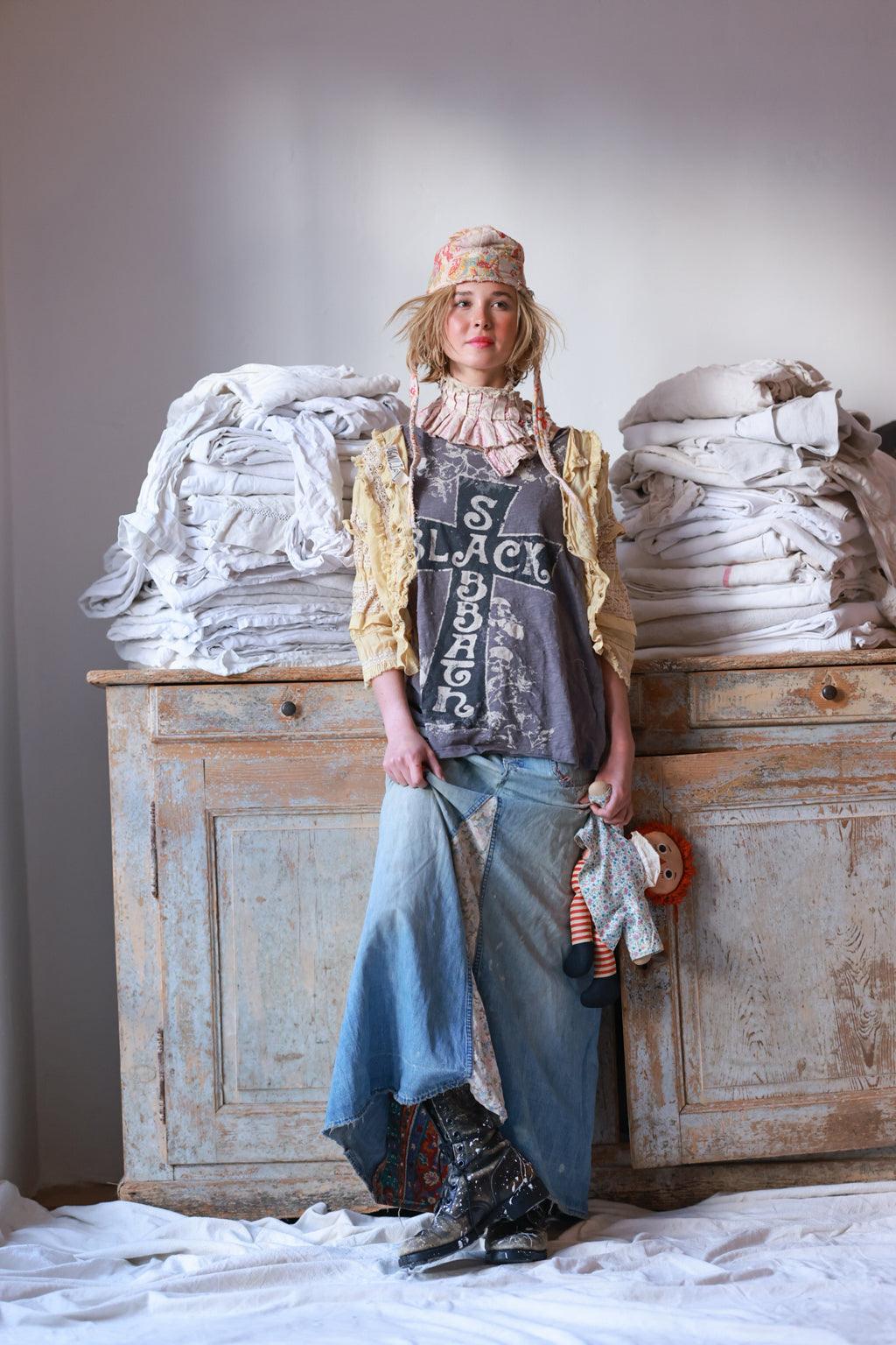 Woman wearing Magnolia Pearl artisan vintage lace jacket, whimsical layered boho style