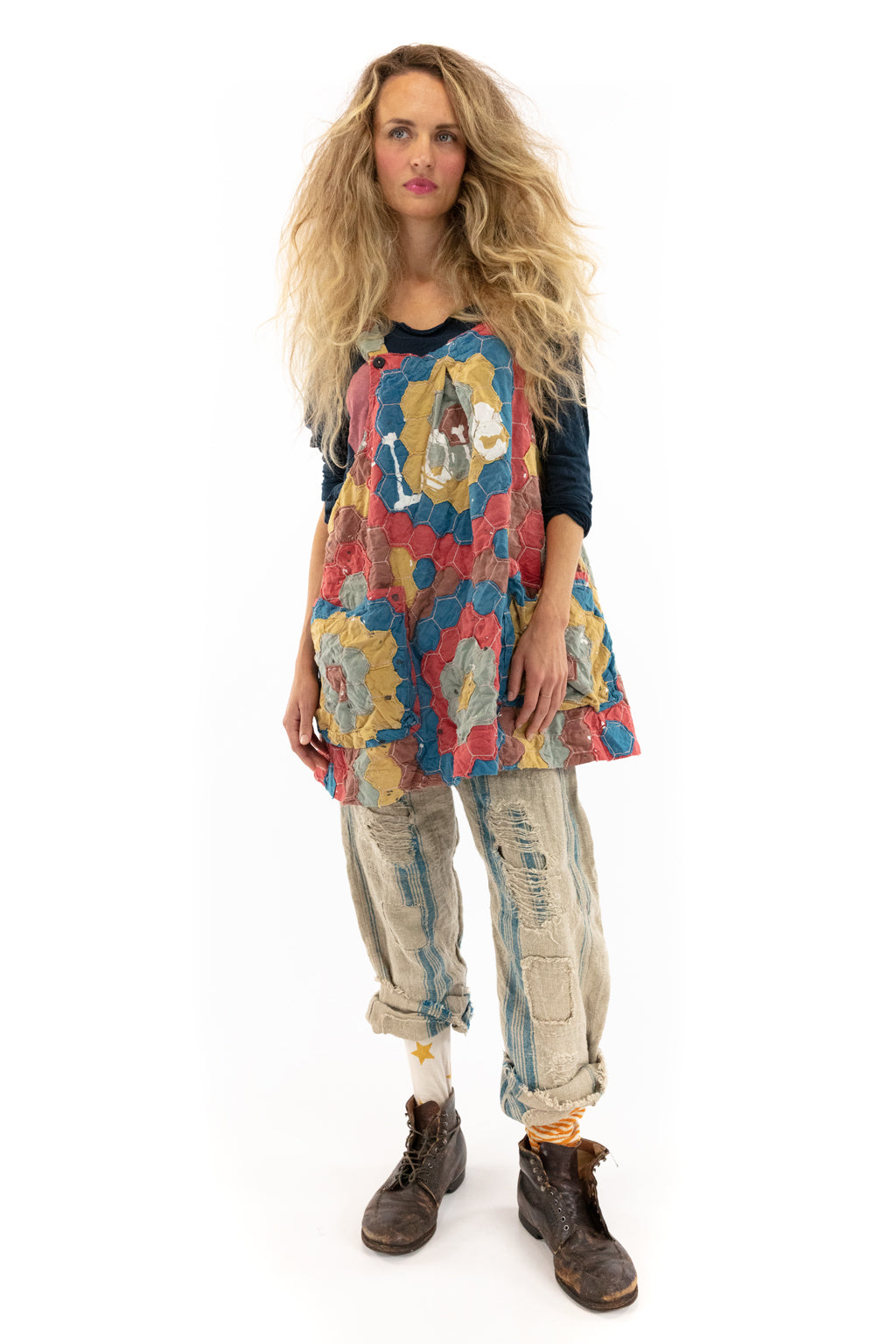 Woman in Magnolia Pearl artisan patchwork apron dress, vintage pants, whimsical boho style