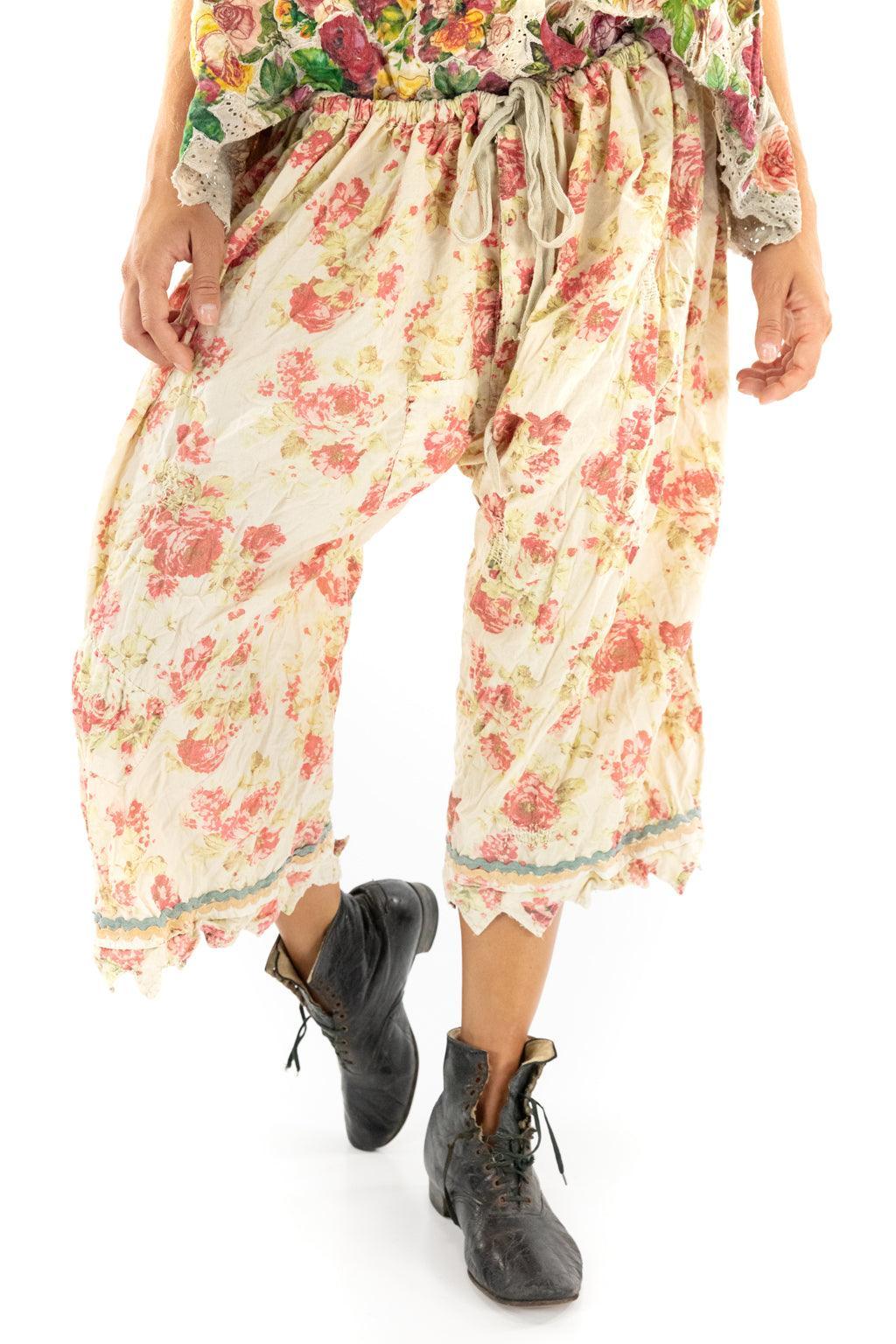 Woman in Magnolia Pearl artisan vintage floral bloomers, whimsical cat top, and matching hat