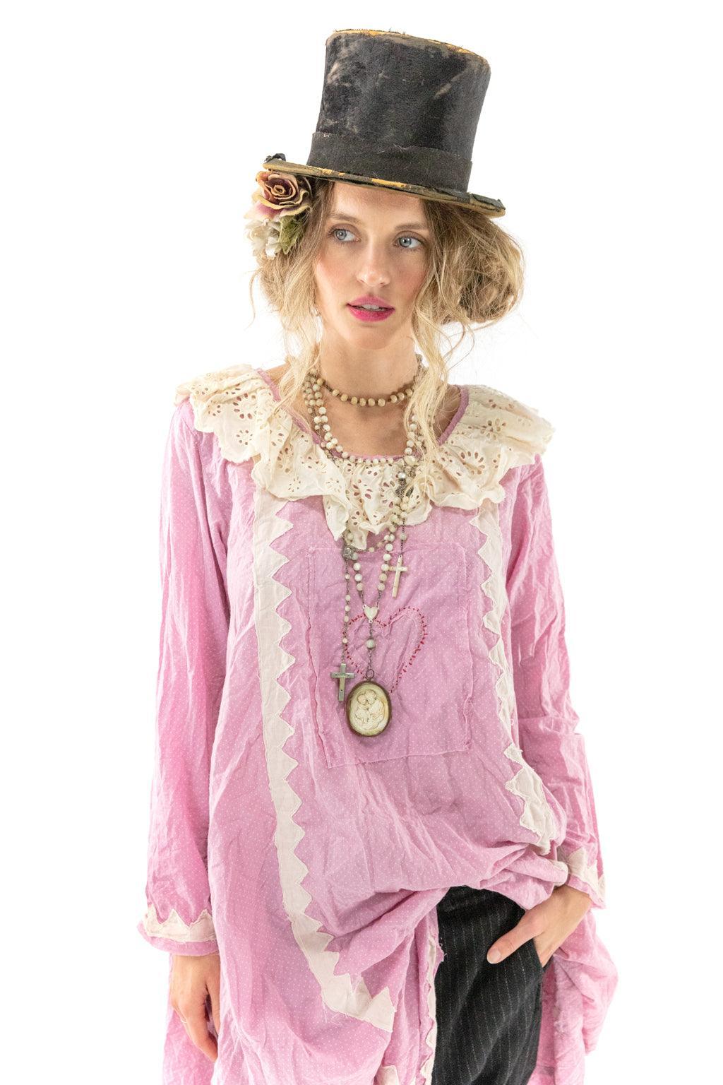 Magnolia Pearl model in pink vintage artisan dress, lace collar, top hat, layered jewelry