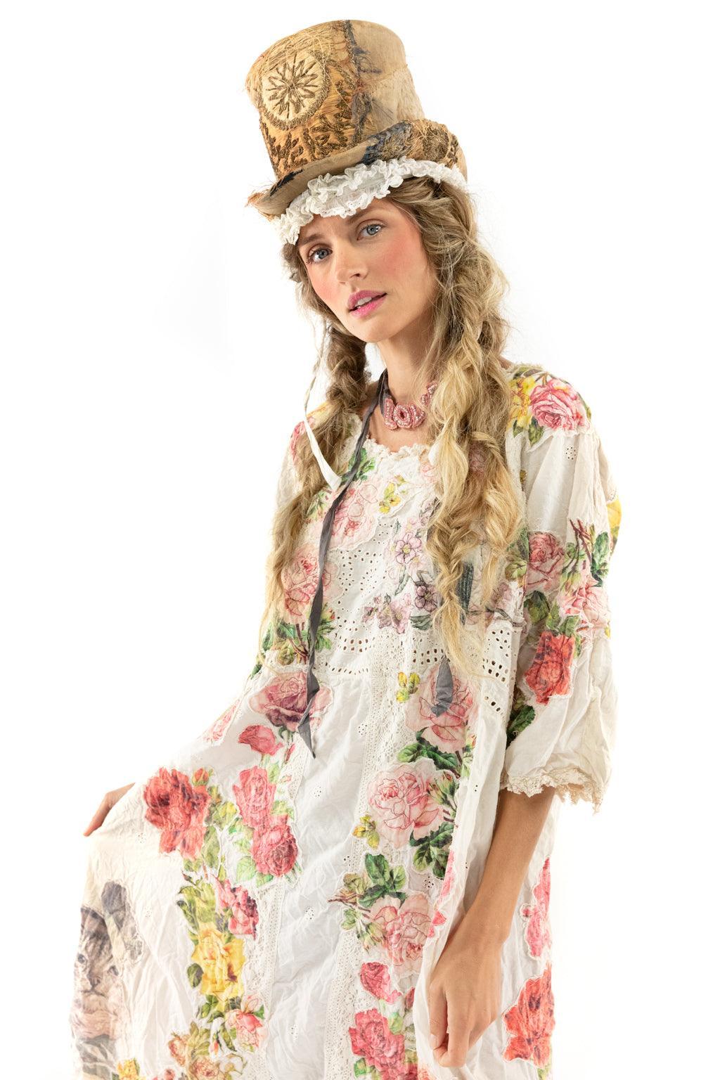 Woman in Magnolia Pearl vintage floral dress and artisan hat, whimsical lace details, unique style