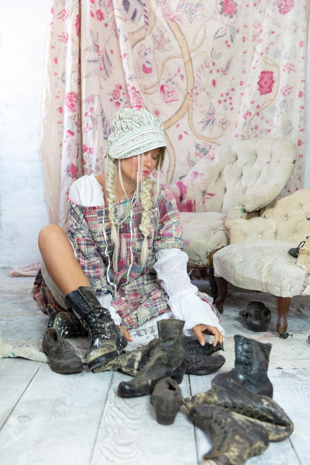 Woman in Magnolia Pearl artisan vintage patchwork dress, bonnet, boots, whimsical shabby decor