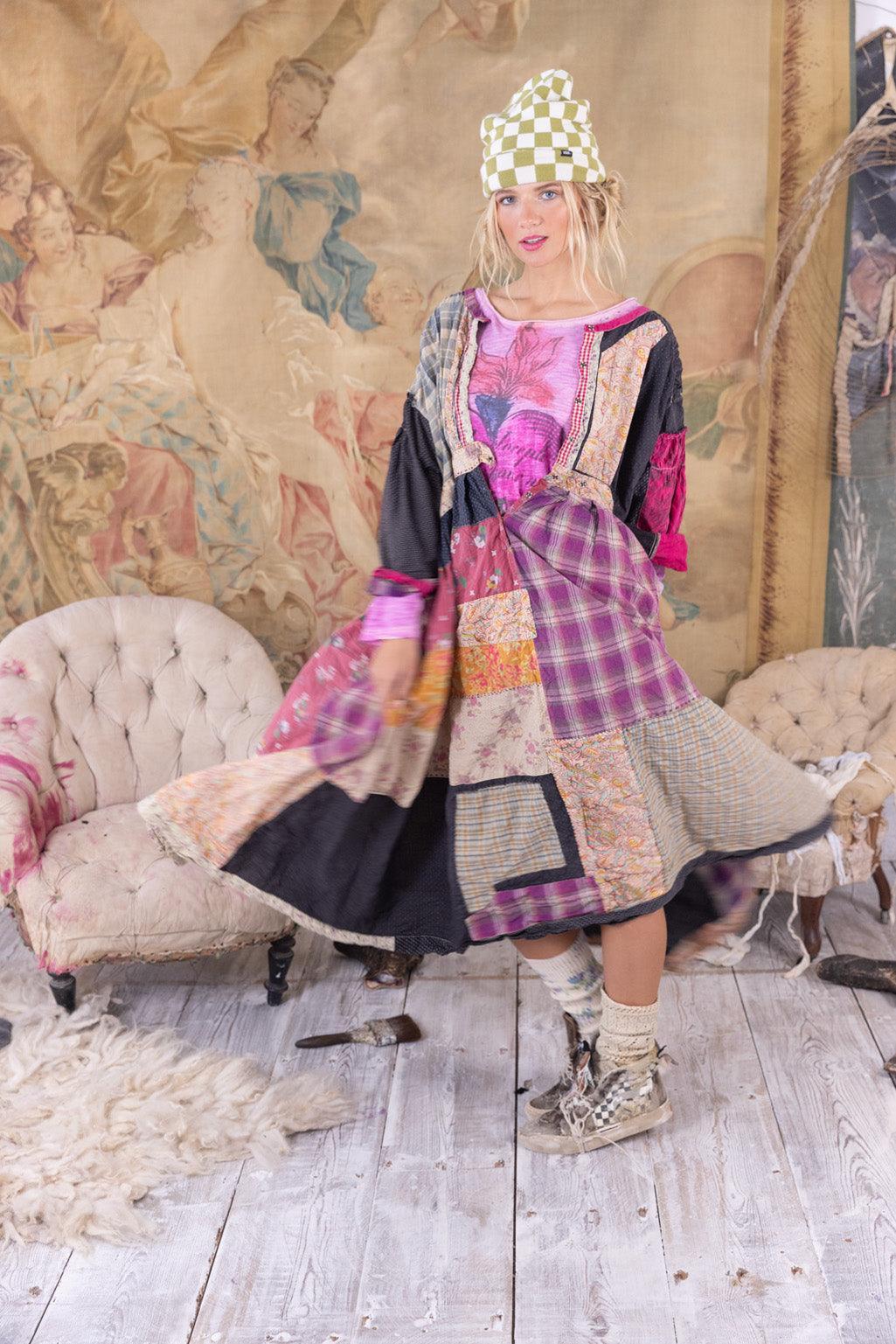 Woman in Magnolia Pearl patchwork artisan dress, vintage eclectic style, whimsical design