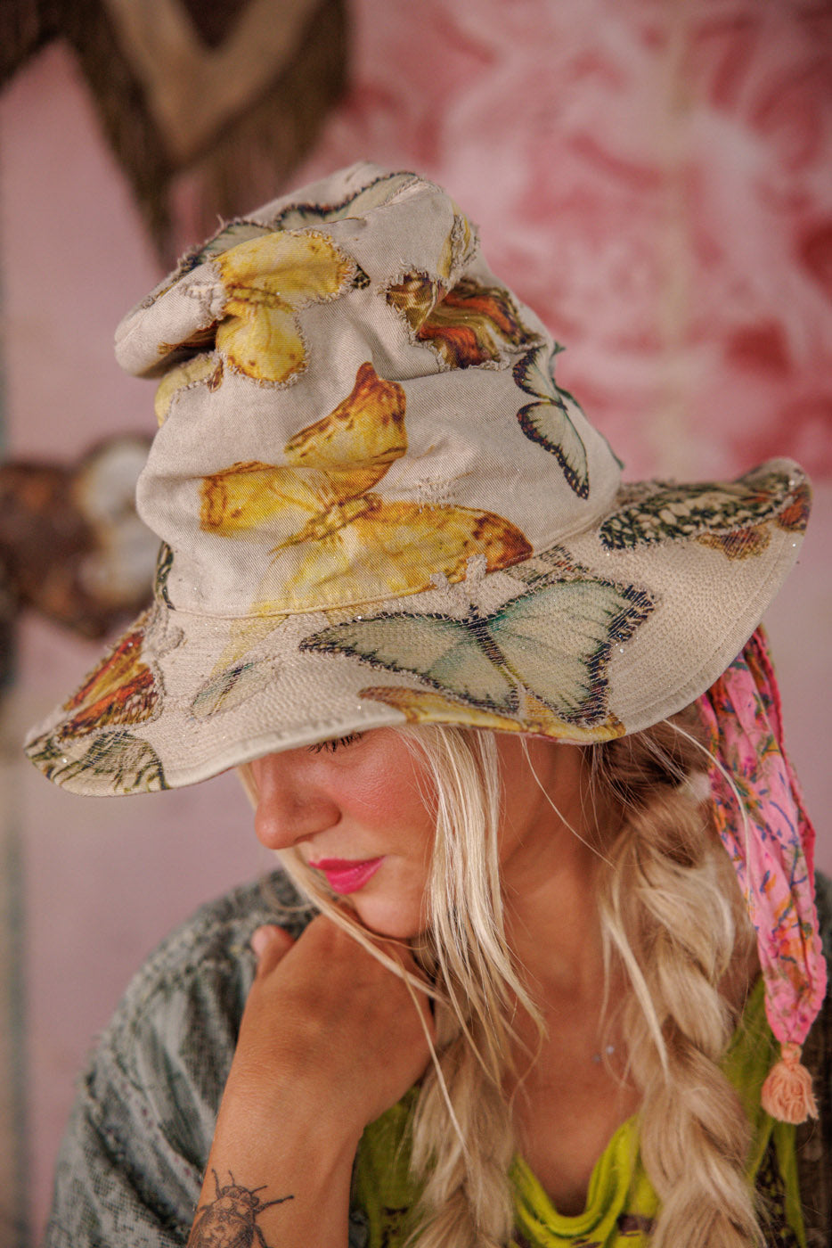 Magnolia Pearl artisan butterfly print bucket hat, whimsical vintage style, worn by woman