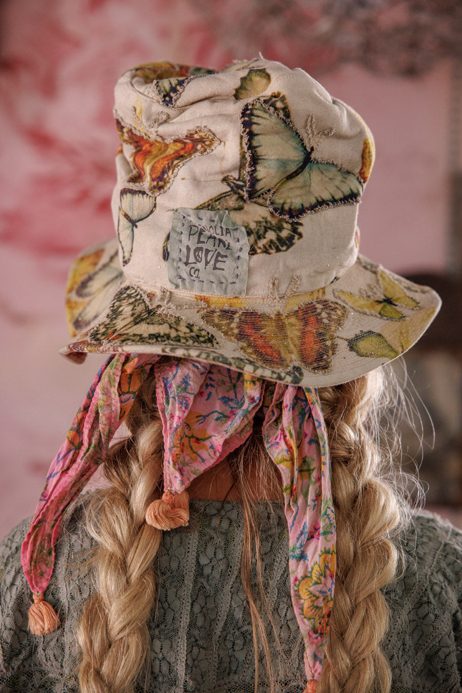 Magnolia Pearl artisan butterfly print bucket hat with patchwork, lace, and whimsical vintage style.