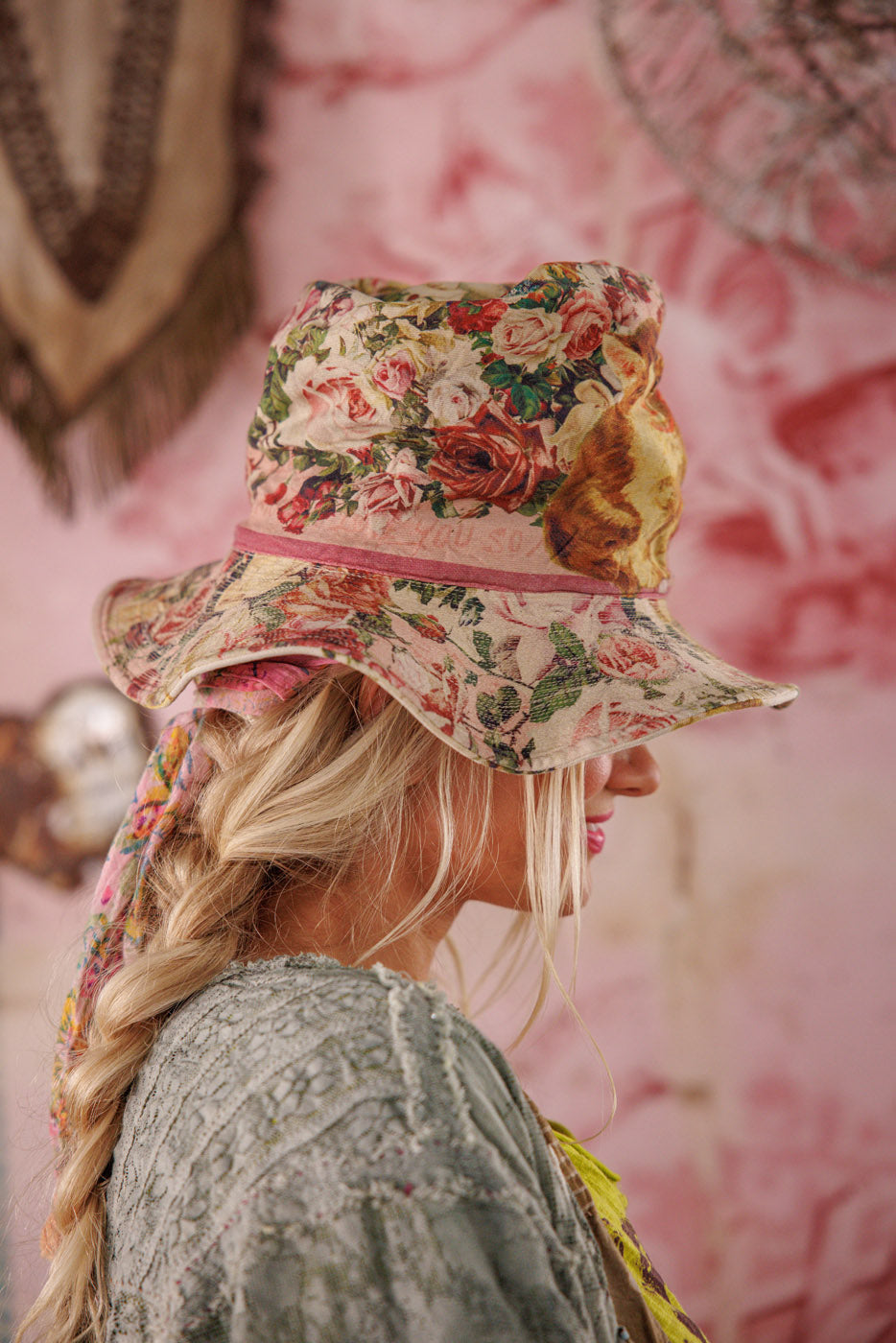 Magnolia Pearl artisan floral bucket hat with vintage style, worn by woman with braided hair