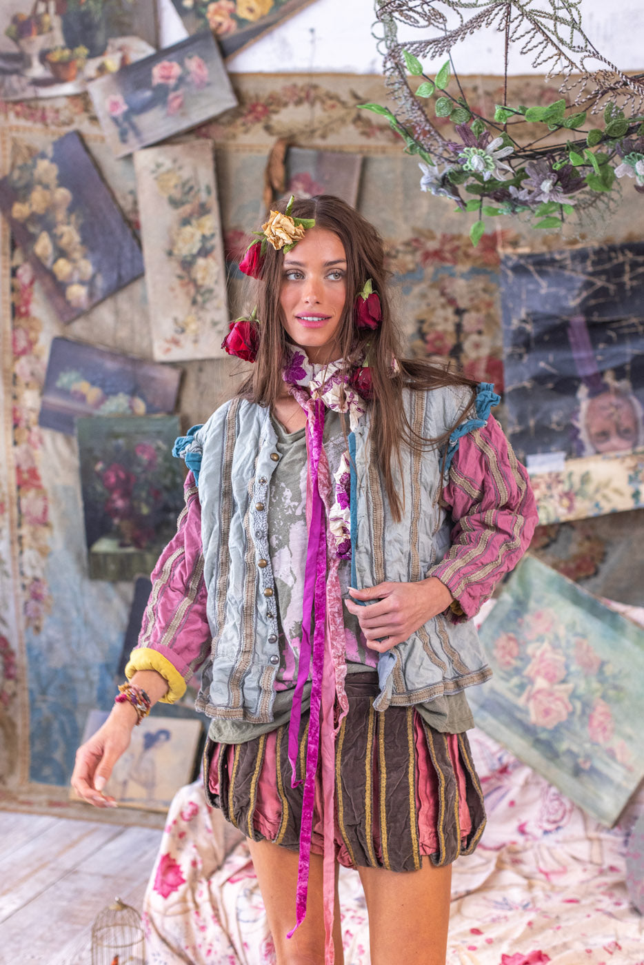 Woman modeling Magnolia Pearl artisan jacket and shorts with vintage, whimsical floral styling