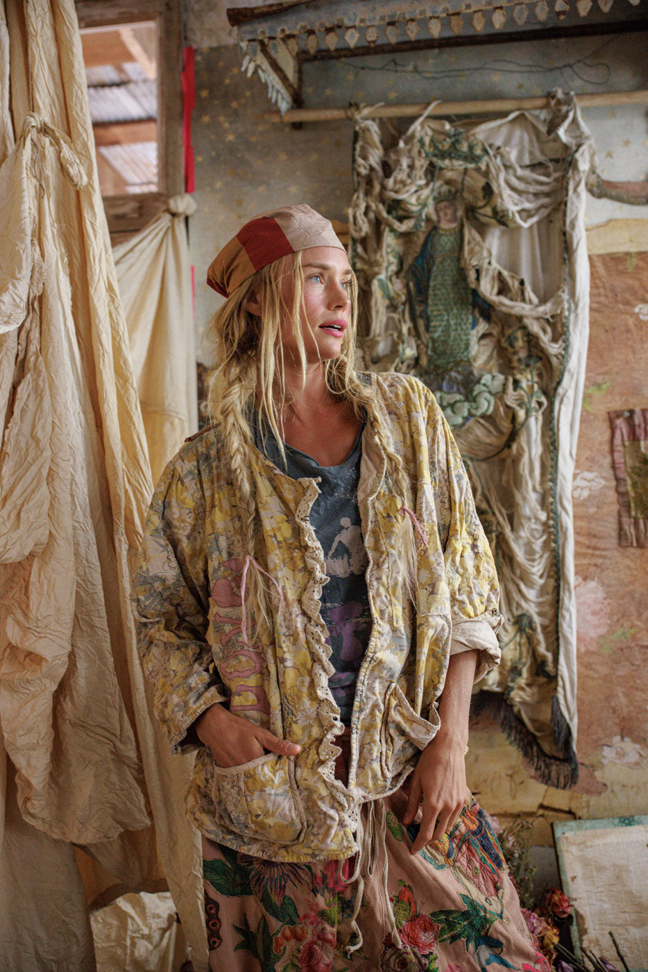 Magnolia Pearl artisan woman in vintage floral quilt jacket and whimsical boho clothing indoors