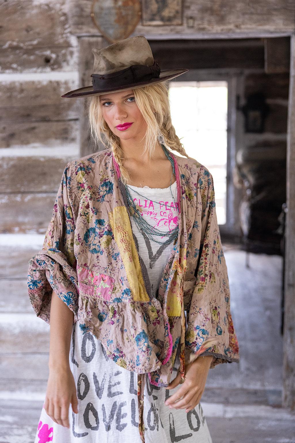Woman in Magnolia Pearl vintage floral jacket and hat, rustic artisan boho clothing style
