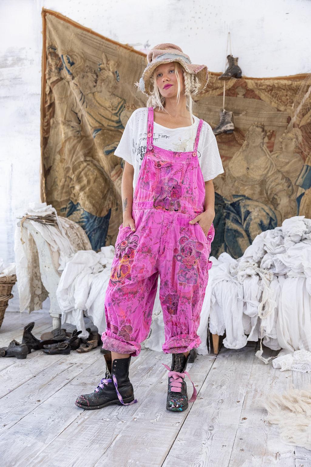 Magnolia Pearl artisan overalls, whimsical pink vintage floral design, styled in rustic room