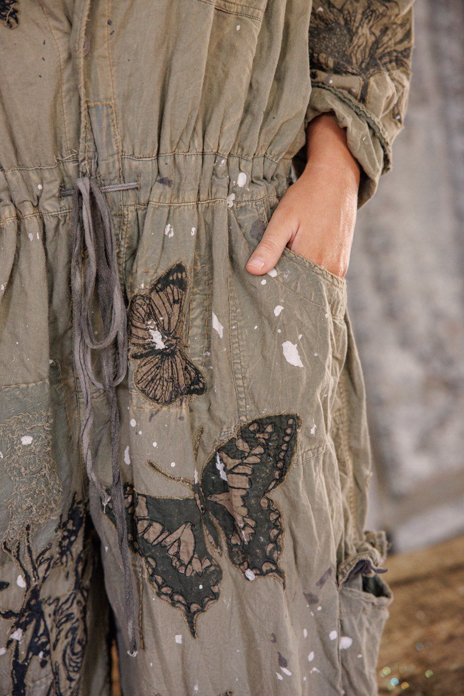 Mother Nature Coveralls Magnolia Pearl Clothing, green color with embroidered butterflies and deer prints and roses.