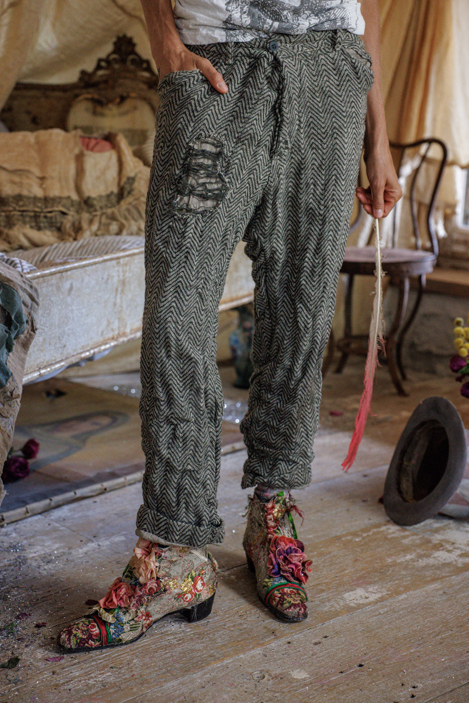 Magnolia Pearl artisan herringbone pants with vintage floral shoes in whimsical rustic room