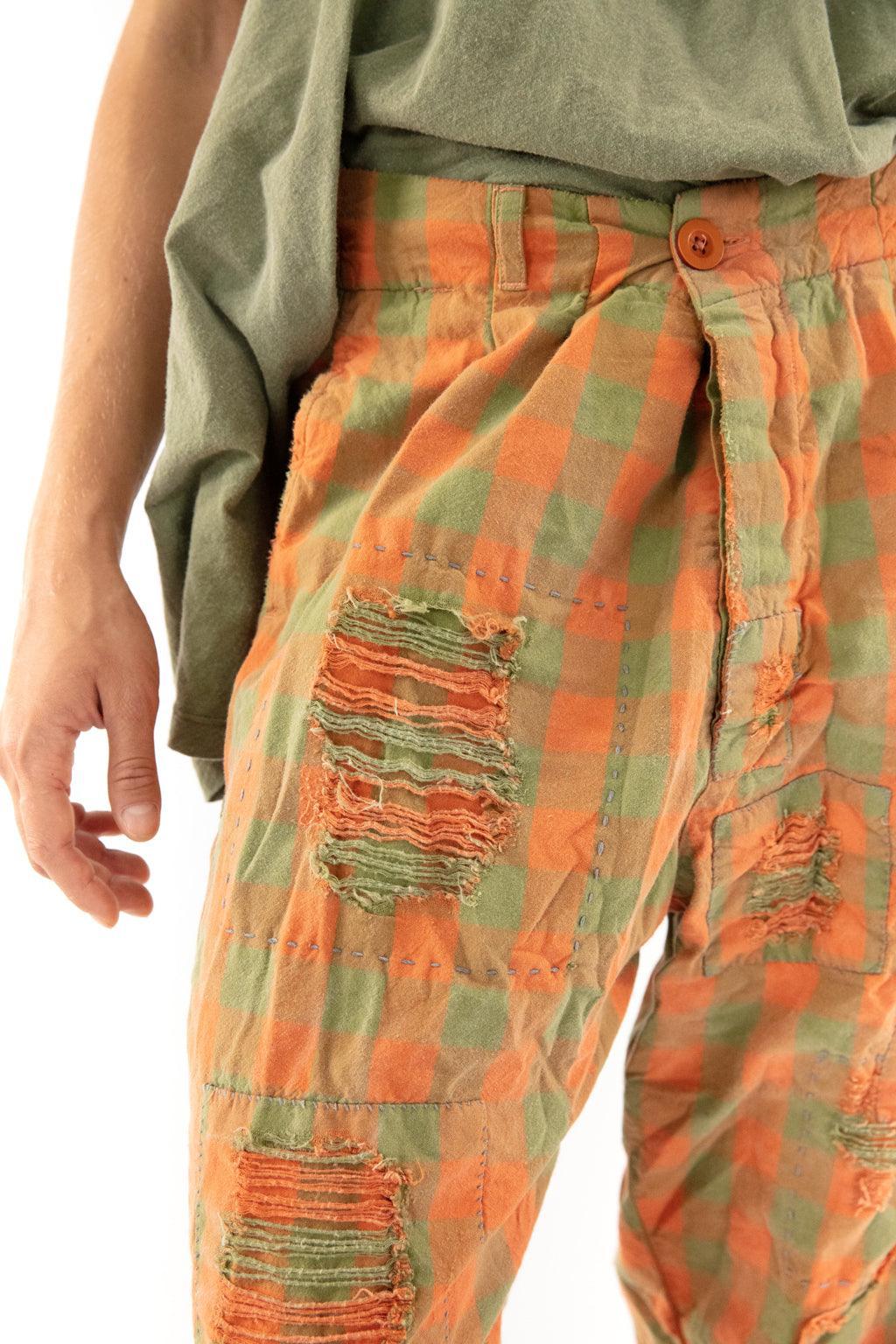 Woman models Magnolia Pearl artisan vintage pants, whimsical checked design, rustic style