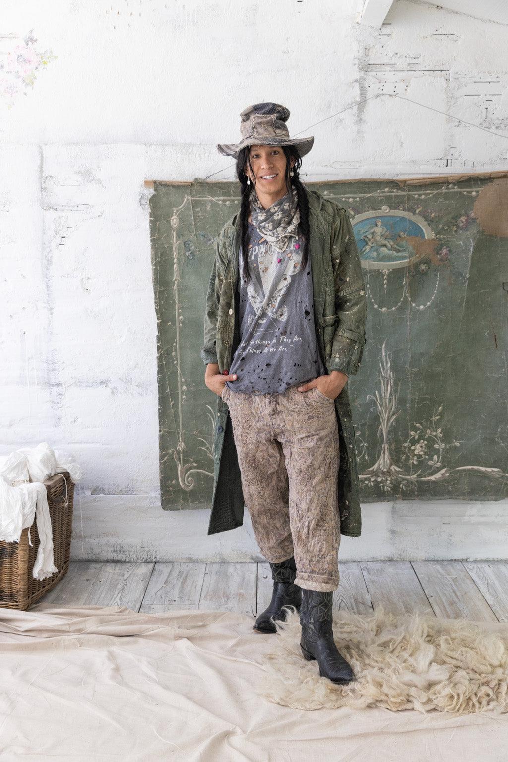 Magnolia Pearl artisan vintage pants outfit, whimsical distressed clothing, rustic studio setting