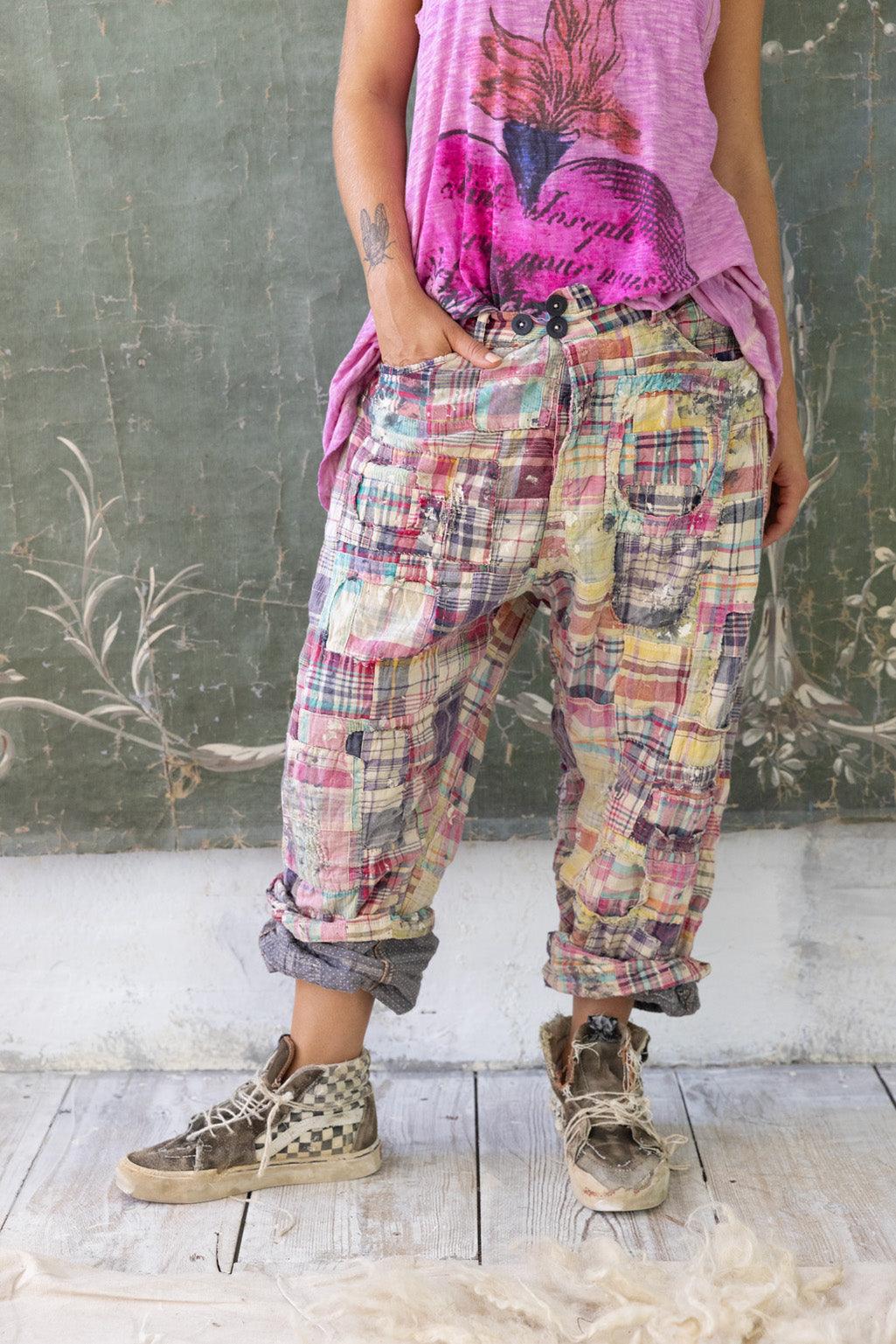 Magnolia Pearl patchwork plaid pants with vintage artisan style, whimsical design, and distressed sneakers.