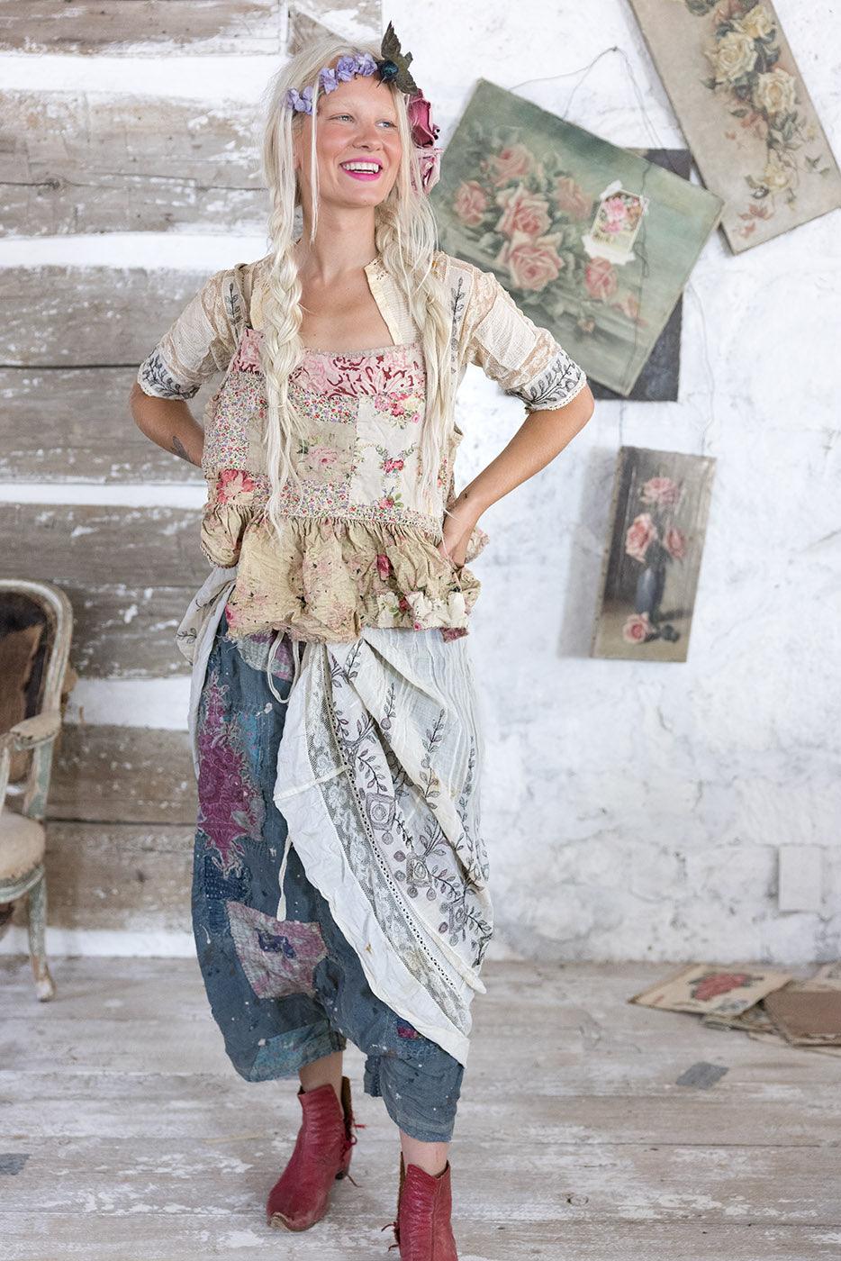 Woman wearing Magnolia Pearl artisan vintage-inspired patchwork pants and whimsical floral top