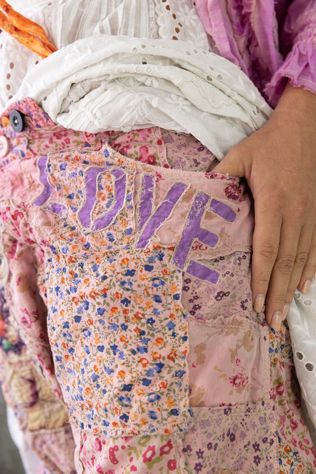 Magnolia Pearl artisan floral patchwork shorts with 'LOVE' embroidery, whimsical vintage style