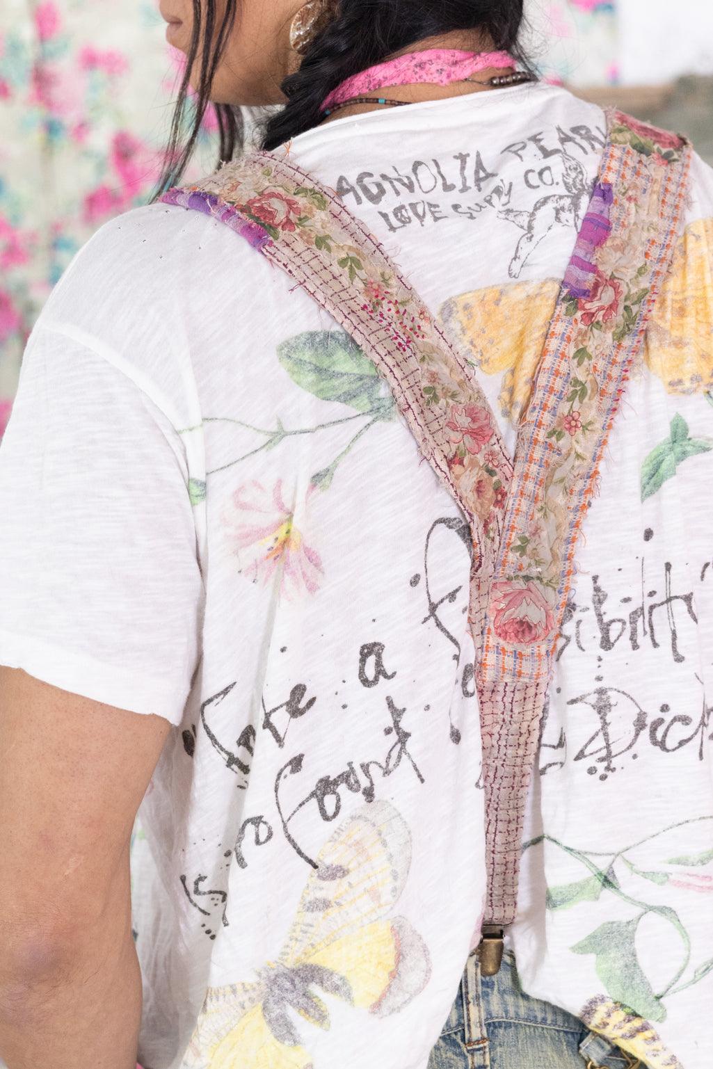 Magnolia Pearl artisan floral suspenders over whimsical vintage-style graphic shirt