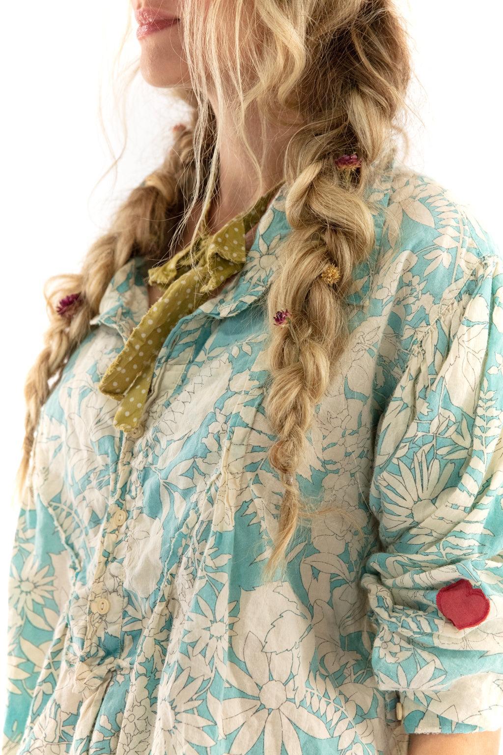 Magnolia Pearl artisan floral vintage blouse with whimsical design, worn by woman with braids