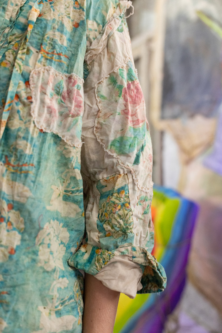 Colorful floral dress with ruffles on a blurred background