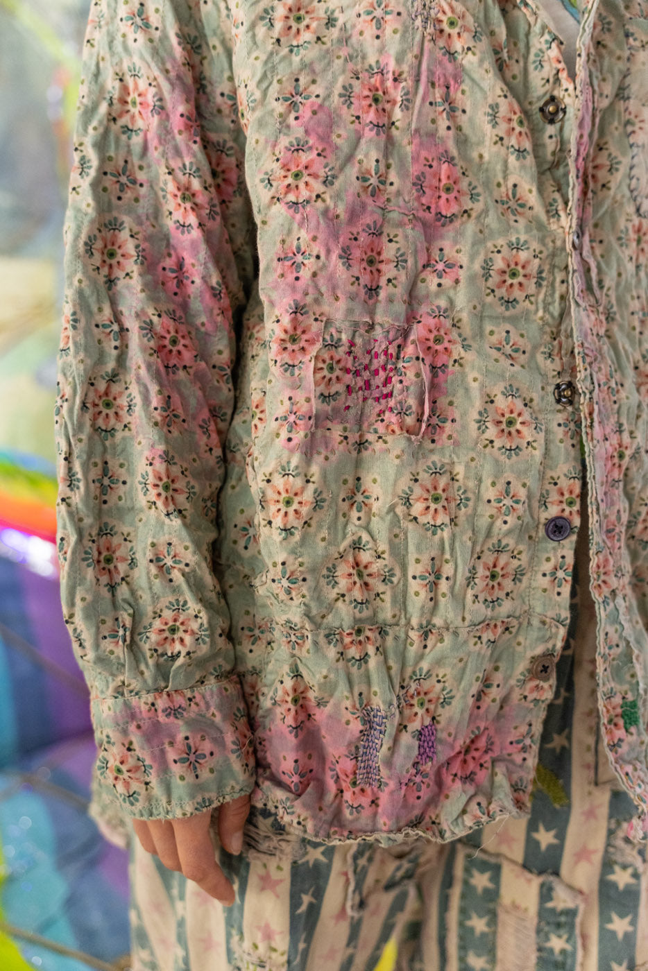 Floral patterned button down shirt with a colorful background