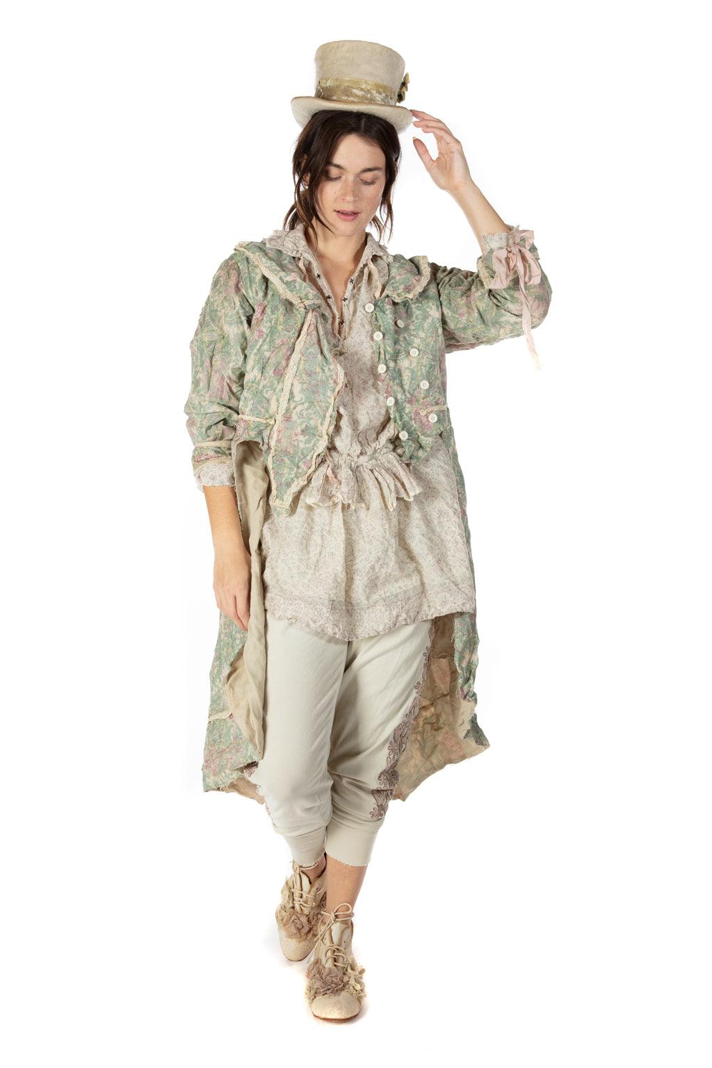 Woman wearing Magnolia Pearl artisan vintage floral coat, lace details, whimsical top hat