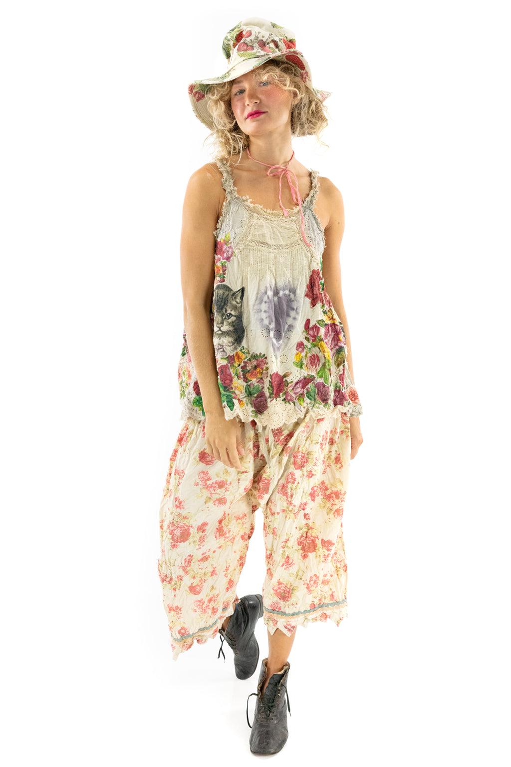 Woman in Magnolia Pearl artisan vintage floral bloomers, whimsical cat top, and matching hat