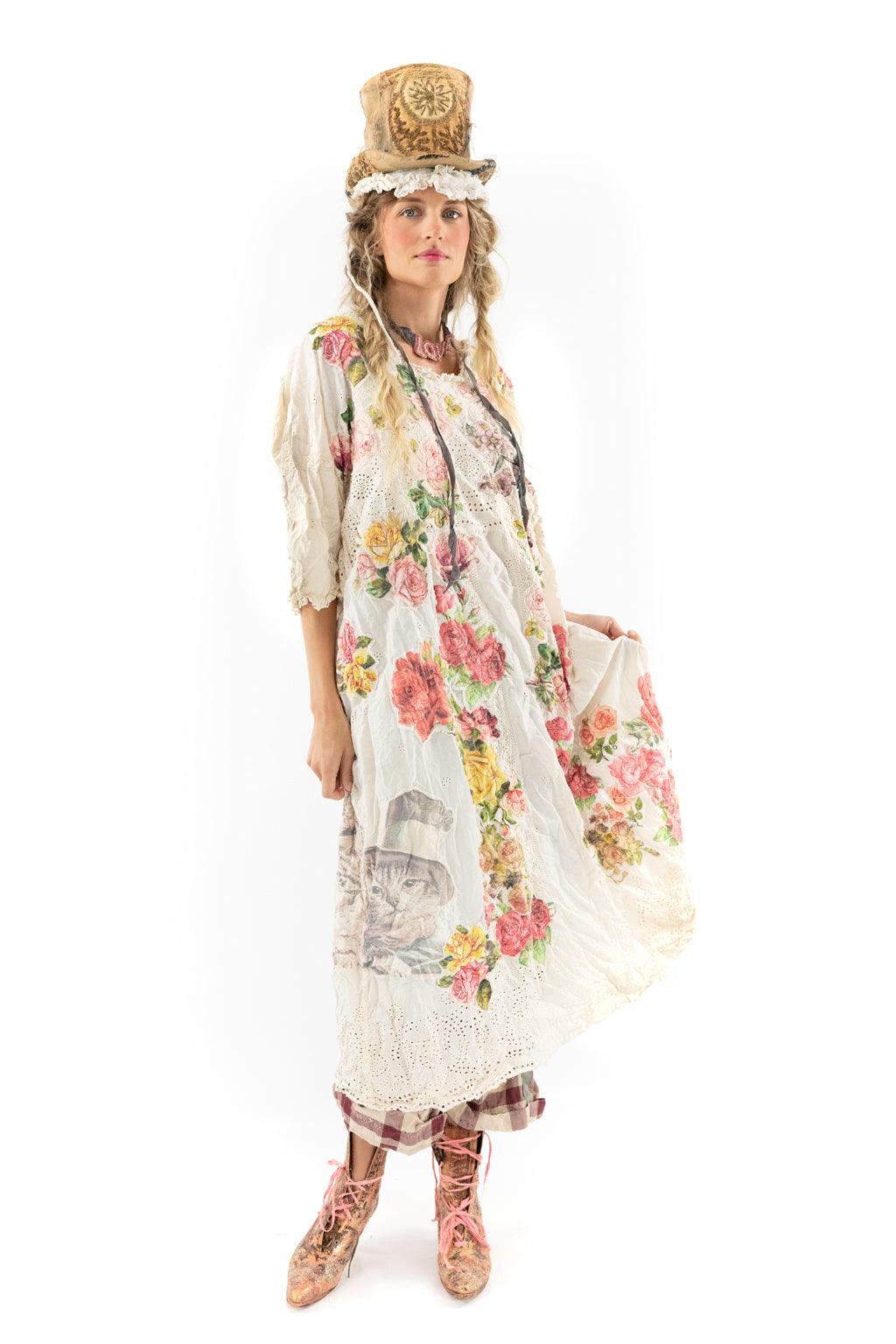 Woman in Magnolia Pearl vintage floral dress and artisan hat, whimsical lace details, unique style