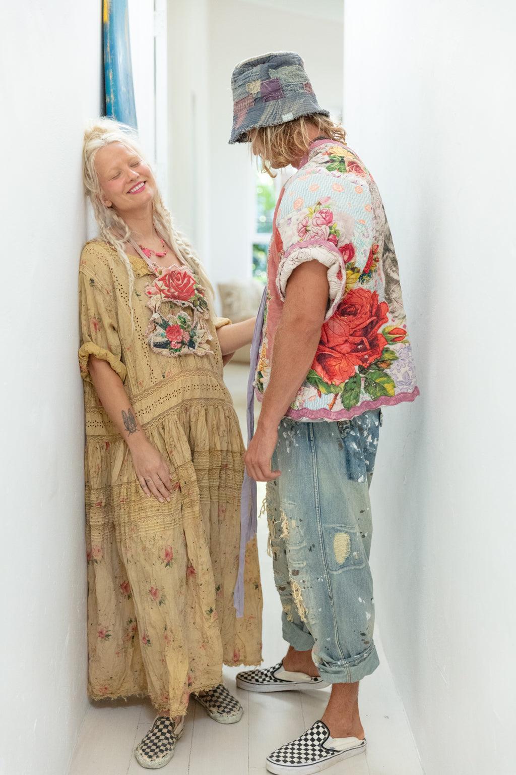 Magnolia Pearl artisan clothing; two people in vintage, whimsical floral patchwork outfits.