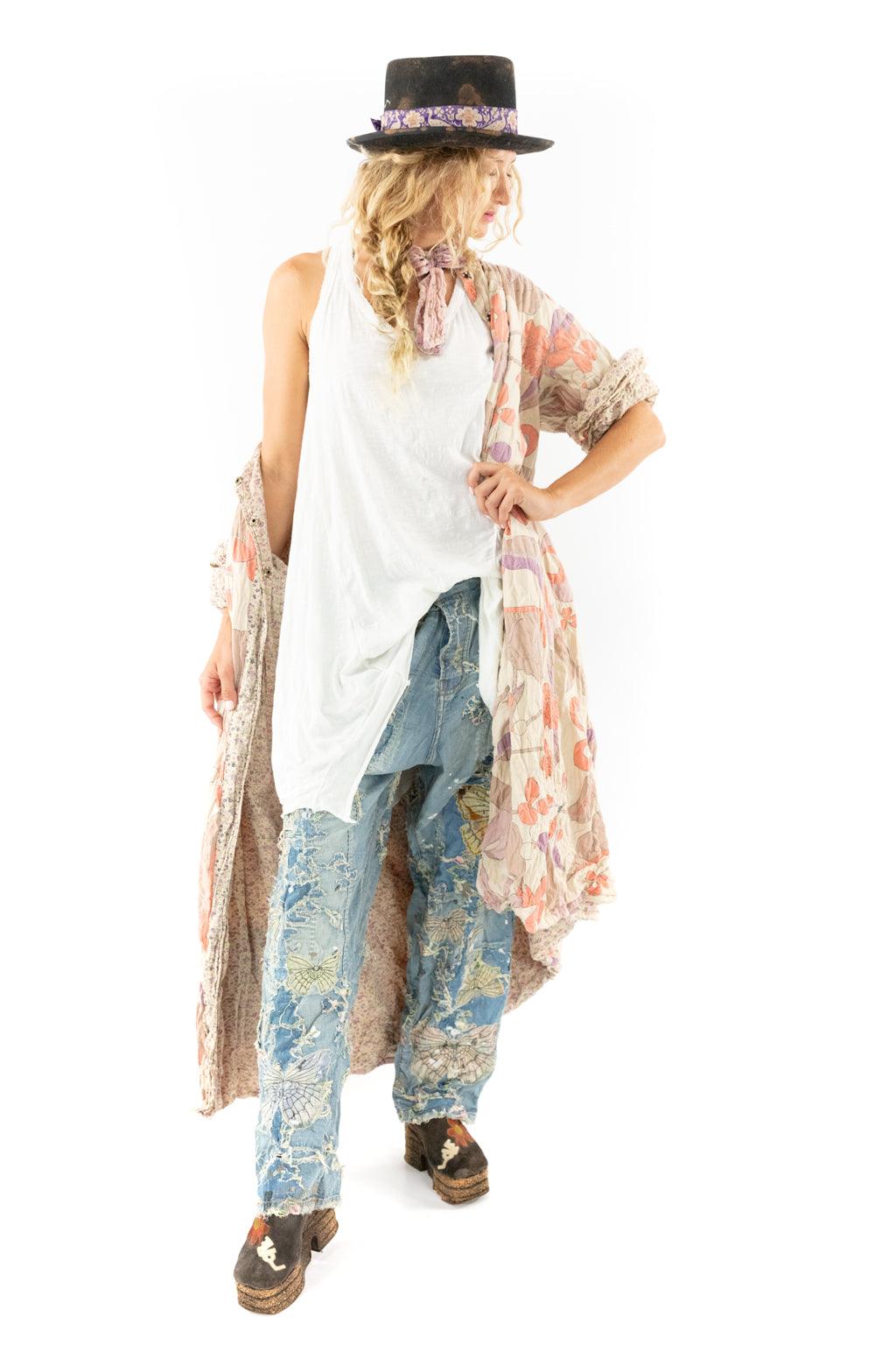 Woman in Magnolia Pearl artisan floral kimono, patchwork jeans, vintage hat and eclectic shoes