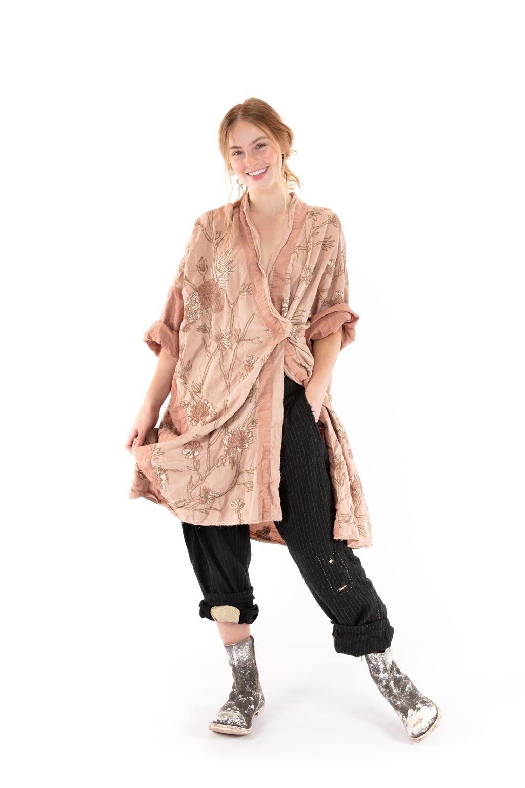 Magnolia Pearl artisan floral jacket with whimsical vintage style, worn over black pants and silver boots